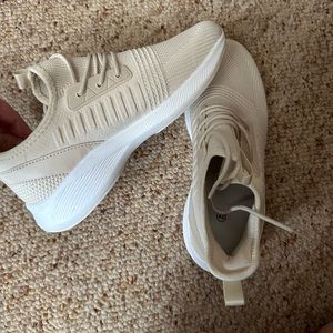 Women’s ivory tennis shoes- size 40. Never wore.